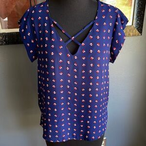Lily White navy tiny heart flowers pattern X neckline top. Medium.